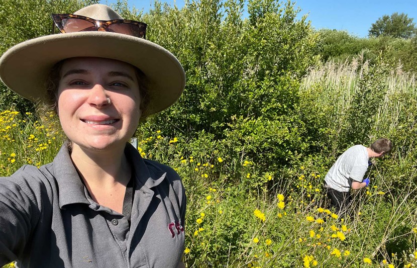 Ecologist Jess Graham in the field with RPS colleague, Ben, collecting water samples