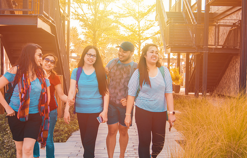 Family walking through residential area.