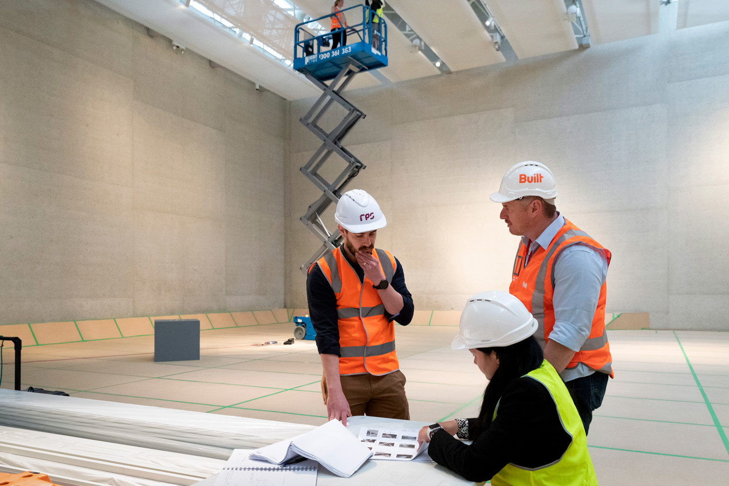 RPS Project Managers Tom Gilbert and Kacie O’Sullivan inspect LED upgrades in the Gallery spaces.