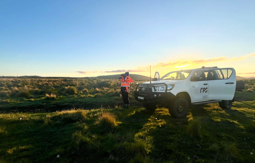 Ecologist Tara Boreham conducting bird surveys for wind farm studies