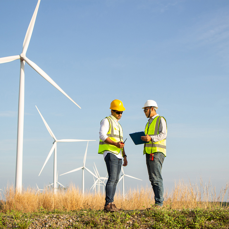 Energy Workers On Site At Wind Farm Installation