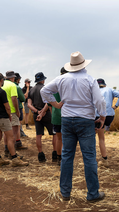 Rural Australian Community Members Gather In Paddock